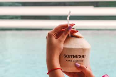 Coconut and pool at Somerset Rama 9 Bangkok min Coconut and pool at Somerset Rama 9 Bangkok
