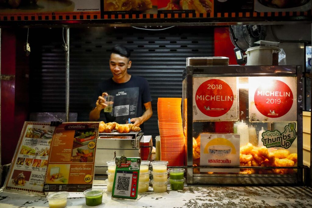 Michelin Star street food vendor Bangkok China Town Trying street food in Chinatown Bangkok - Michelin Star street food stall with crowds in Bangkok Chinatown.