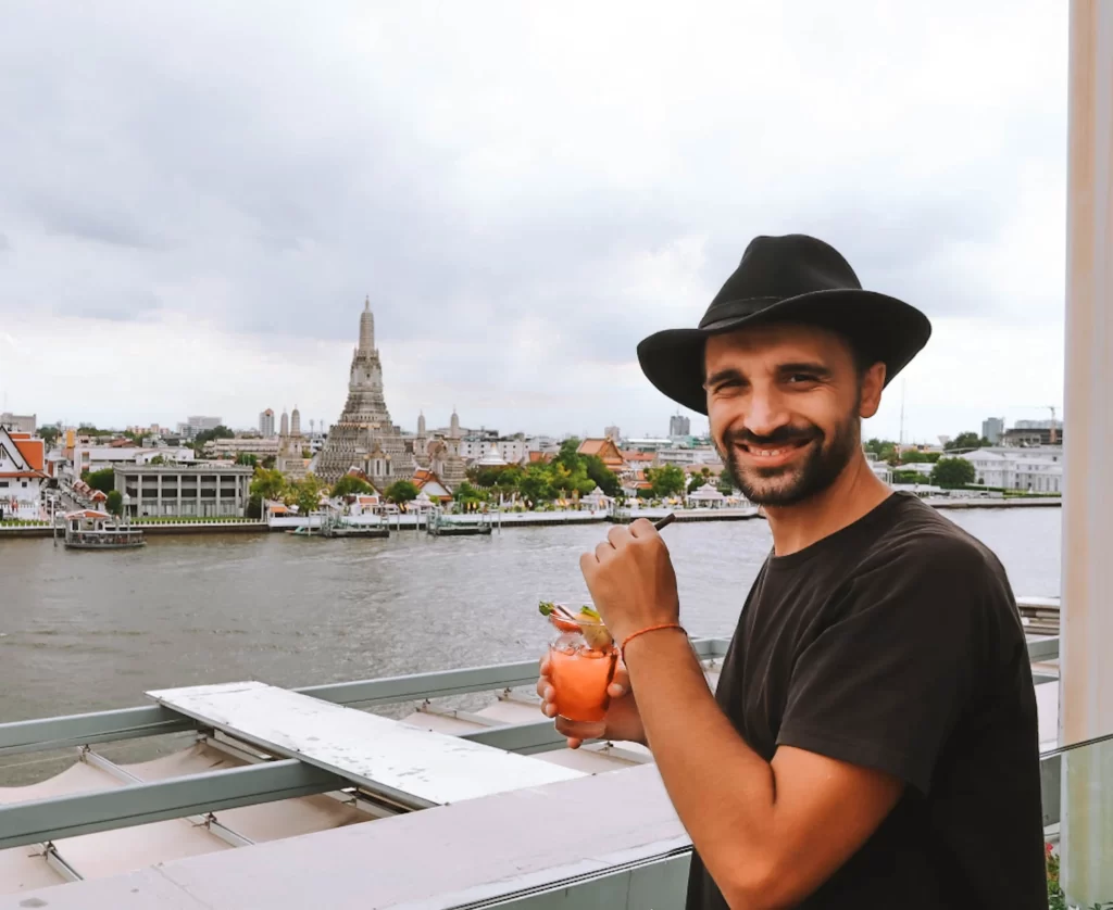 Rooftop bars in Bangkok - Toti drinking a cocktail and enjoying the view | Backpacking Bangkok
