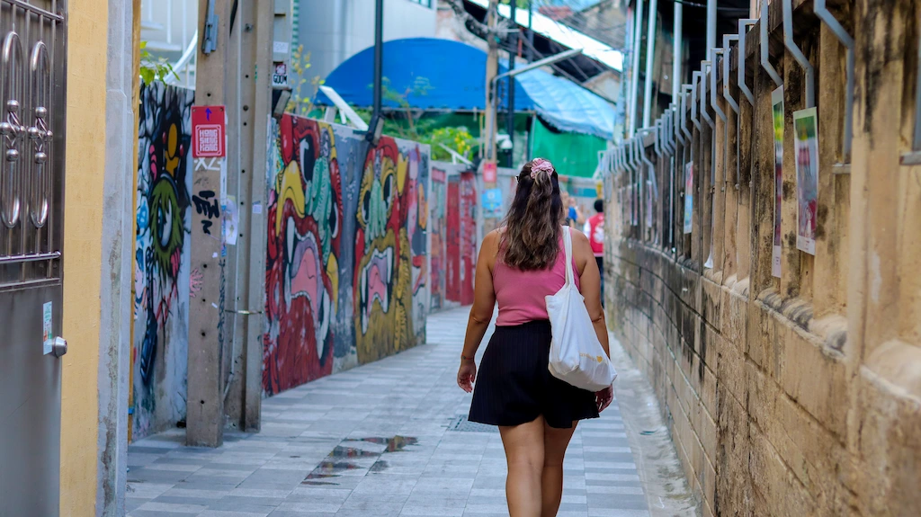 Talat Noi street art Ale walking and enjoying the murals Our walking route of Talad Noi in 2026 - Ale enjoying all the amazing street art in Talad Noi