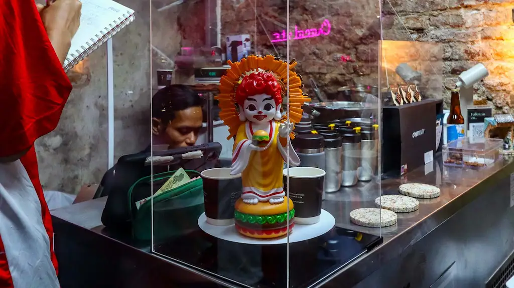 inside 32 bar specialty chocolate Typical shop desk - bar near rusty italian car in talad noi