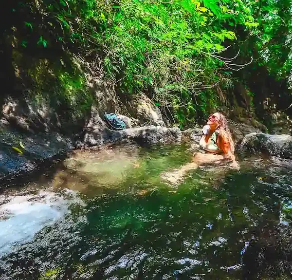 Enjoying the upper natural pool at Gembleng Waterfall