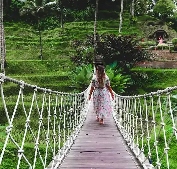 Bimba walking on a suspension bridge in Ubud