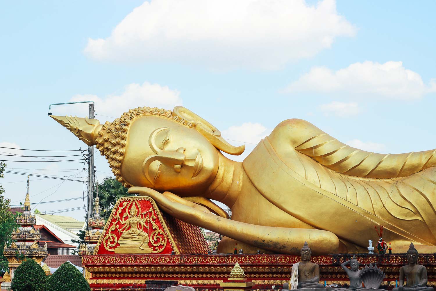 Reclined Buddha in Vientiane Sacred Buddhist temple Wat That Luang Tai Reclined Buddha in Vientiane - Sacred Buddhist shrine and temple in the Laos Capital in the Wat That Luang Tai temple