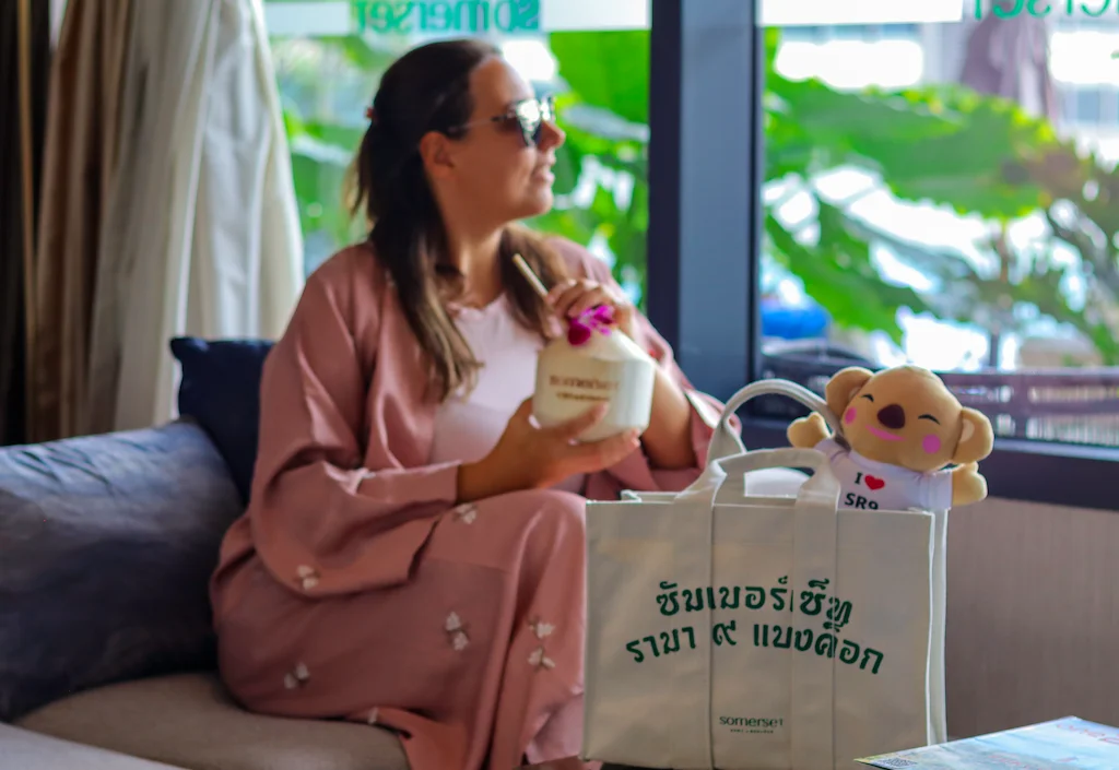 Enjoying a coconut inside the Lounge area at Somerset Rama 9 Bangkok