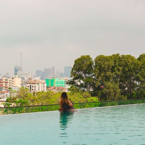 Bimba swimming in the pool and enjoying the view of Bangkok from Somerset Rama 9 | Where to stay in Bangkok first time