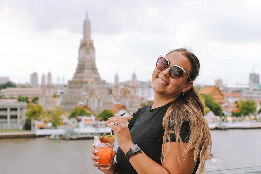 Drinking in front of Wat Arun at one of the best rooftop bars we found in Bangkok
