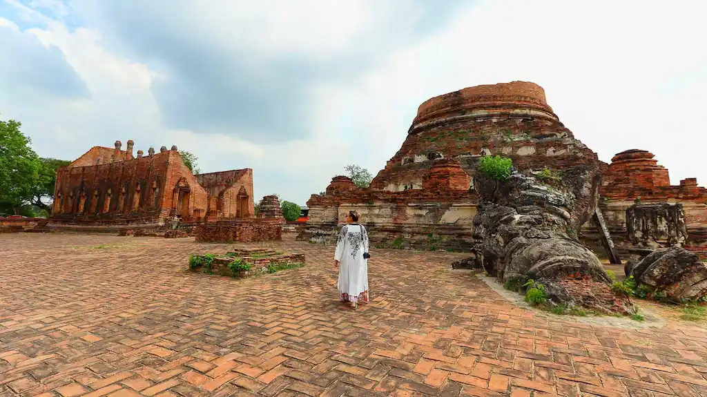Bimba walking around Ayutthaya temple ruins Best day trip to Ayutthaya