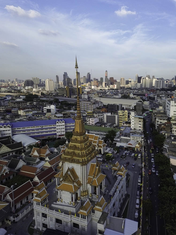 Temple in Chinatown close to the gate Drone view of Bangkok skyline over the Golden Buddha, Wat Traimit.
