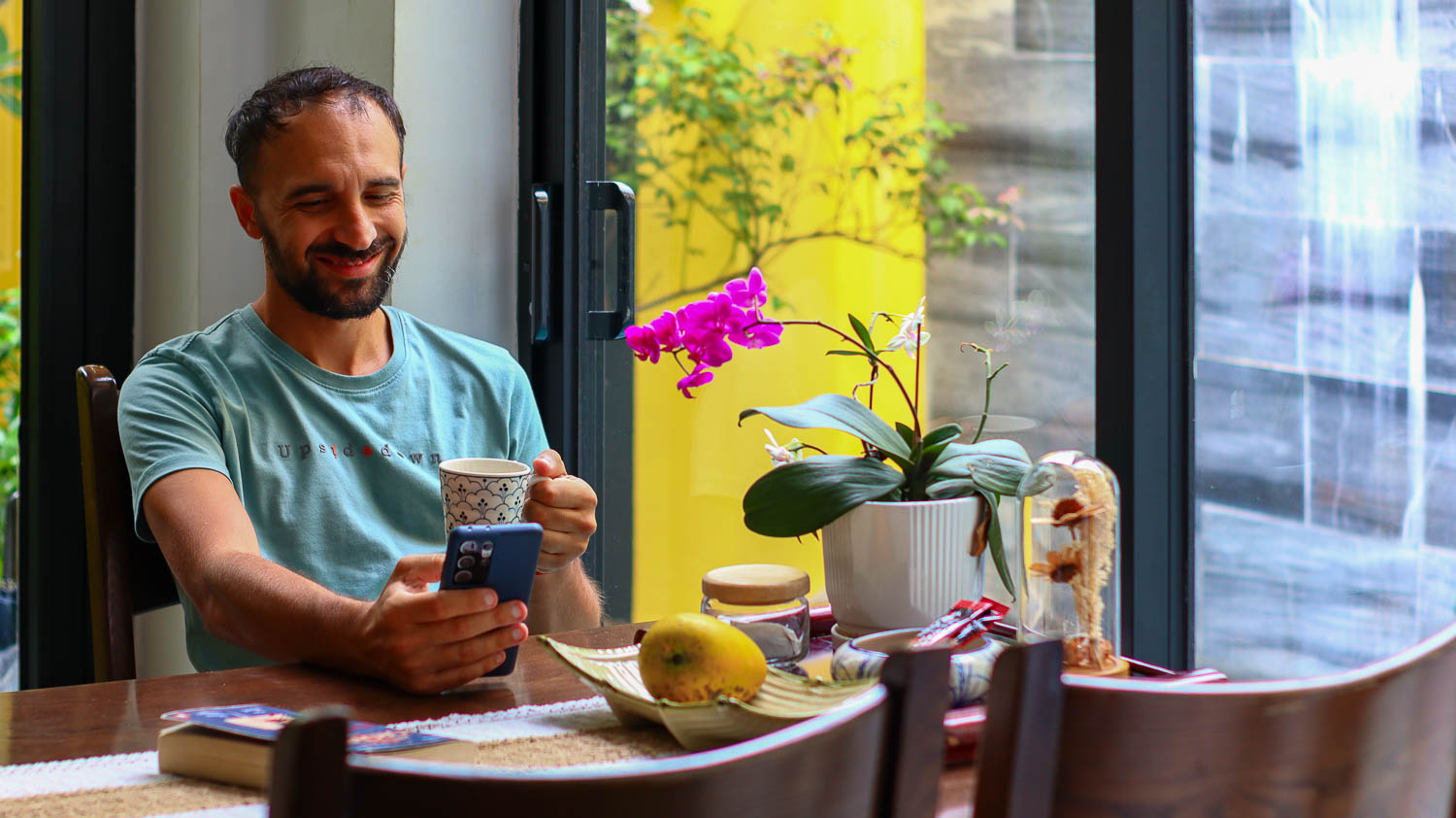Accommodation in Hoi An - Toti drinking a coffee in the kitchen | Where to stay in Hoi An
