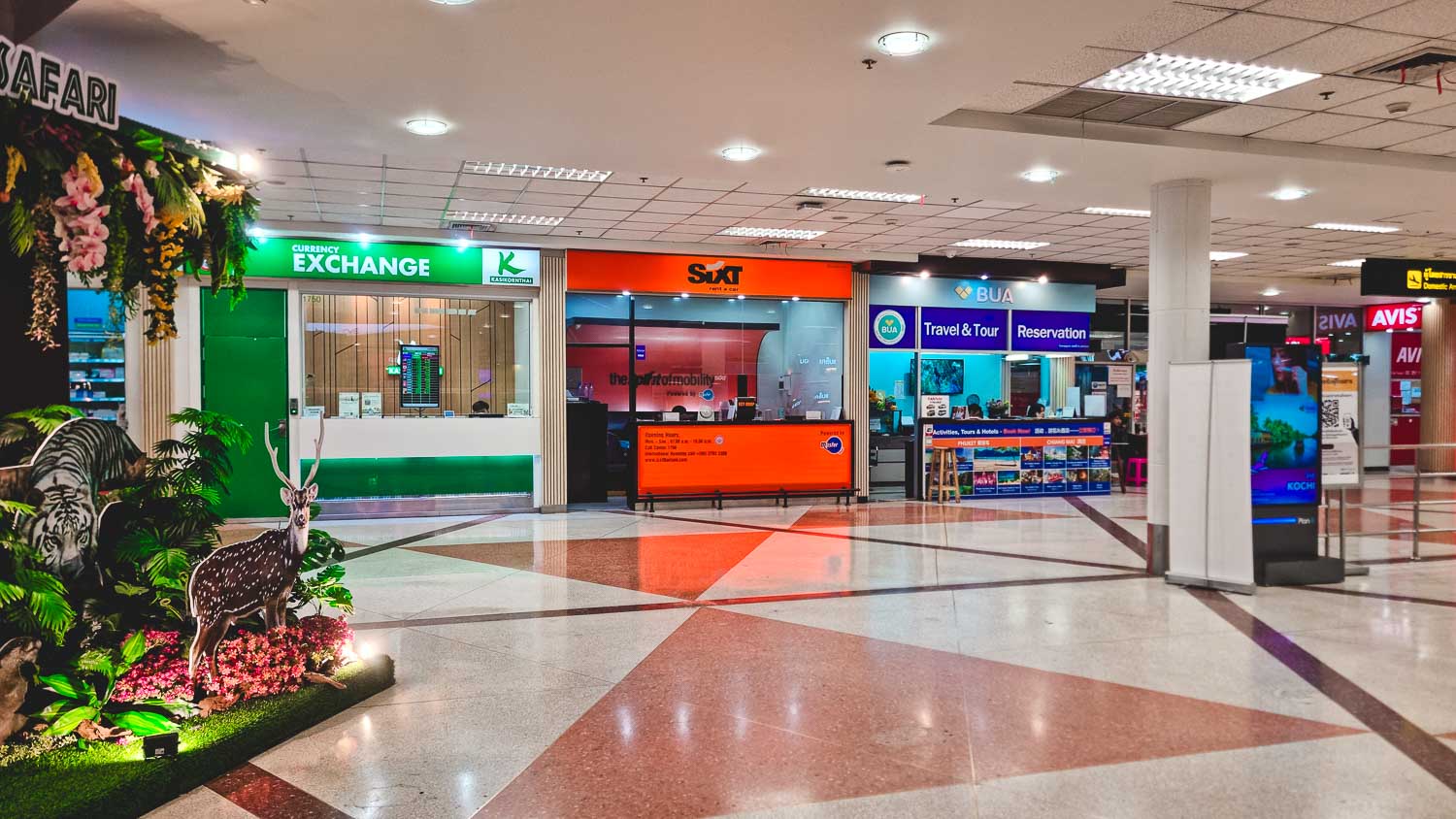 Car hire desks at Chiang Mai Airport for travellers driving into the city