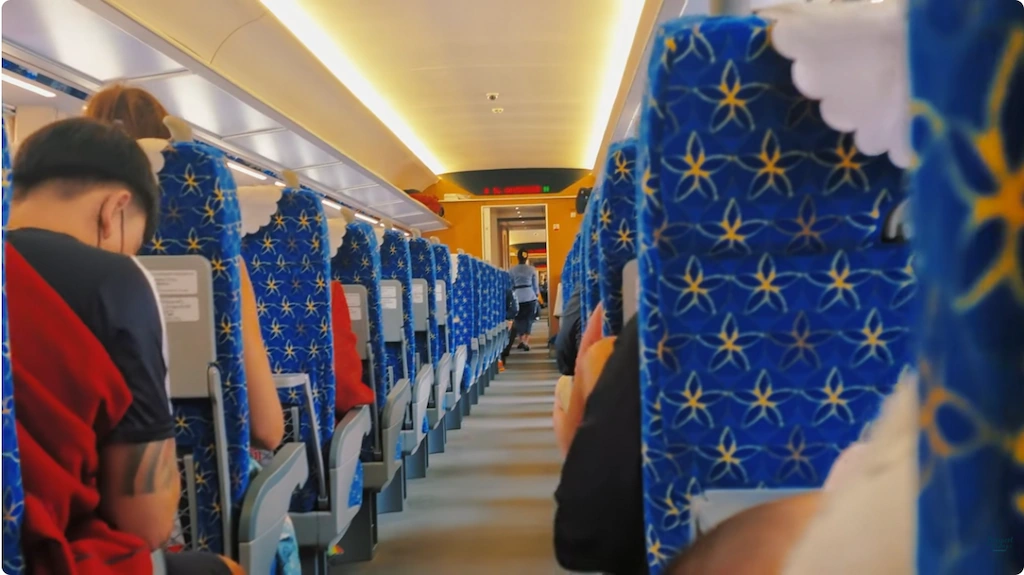 Interior view of second-class seating on the Laos bullet train from Vang Vieng to Vientiane.