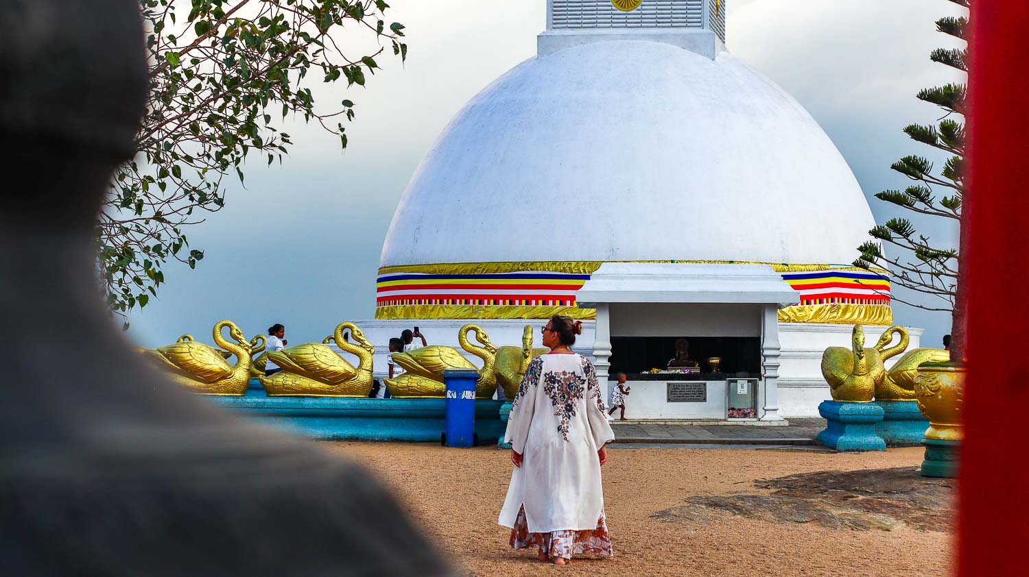 Bimba walking towords the white stupa in Kandy Bimba walking towords the white stupa in Kandy