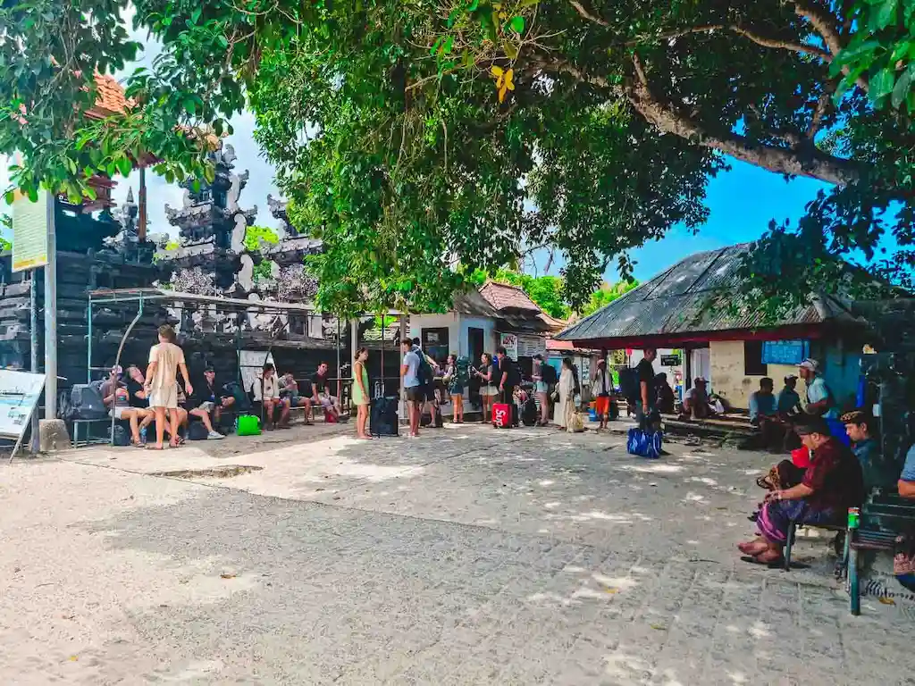 Mushroom Bay port in Nusa Lembongan travellers waiting for the express boat to Bali