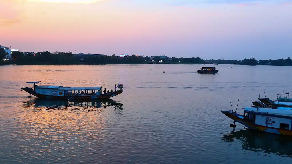 While planning a one month itinerary of Vietnam you must walk on the River at sunset in Hue