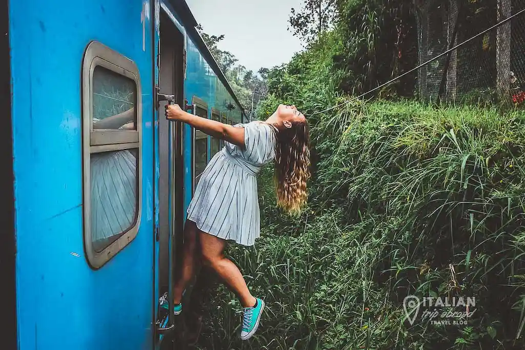 Sri Lanka blue train Bimba hanging outside Sri Lanka blue train - Bimba hanging outside the door of the train