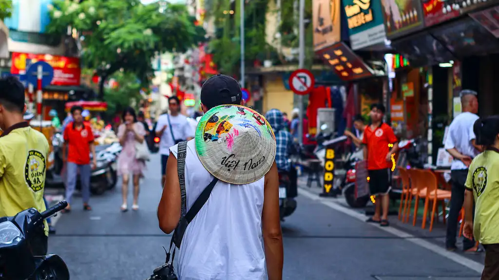 Toti walking around the streets of Hanoi - One month in Vietnam itinerary