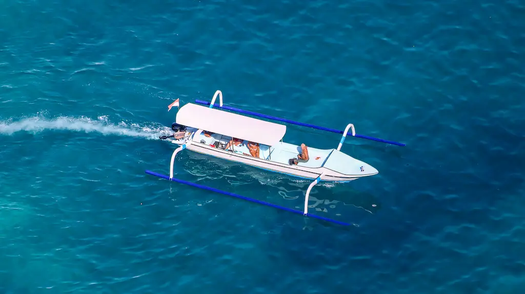 A boat with tourists for a tour of Nusa Penida and snorkelling around