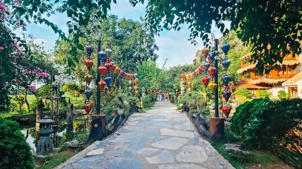 The stylish entrance to Hang Mua Cave through a stone bridge with lanterns that at night transform in a charming atmosphere