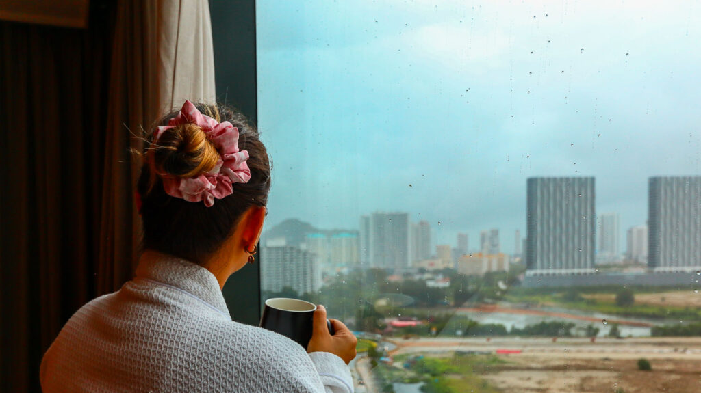 Rainy day and Ale looking outisde the window from the room at G Hotel Penang Rainy day and Ale looking outisde the window from the room at G Hotel Penang