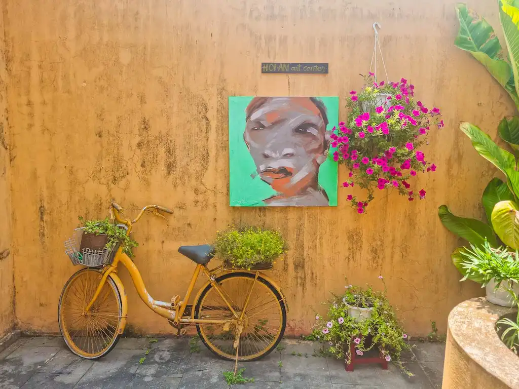 This photo was taken around the old town of Hoi An, it's easy to spot picturesque, yet photogenic spots in hoi an, the bike, yellow mustard pastel houses makes the perfect scene.