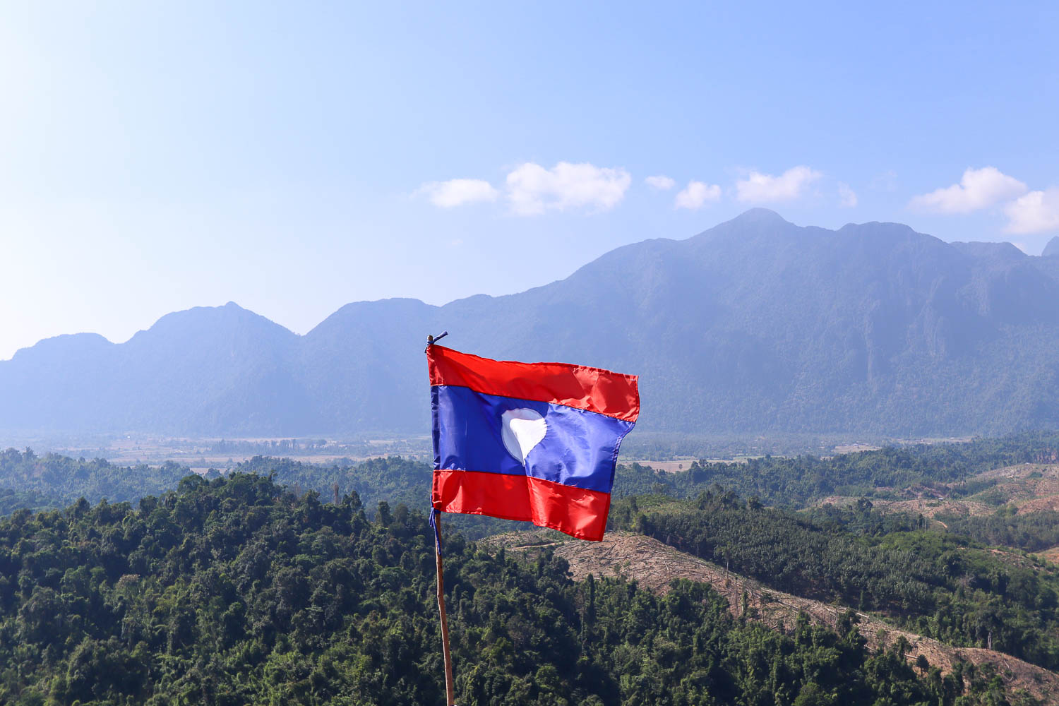 Laos two weeks itinerary flag over nam xay viewpoint