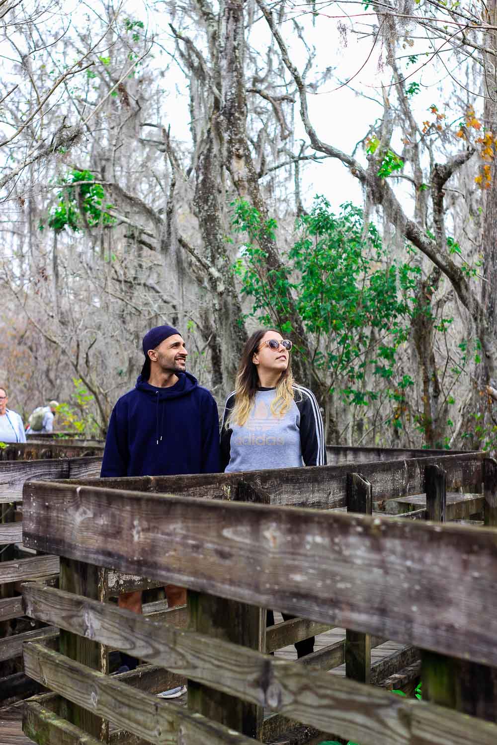 Toti and Ale walking along the boardwalk in Lettuce lake parl | Passport and Stamps