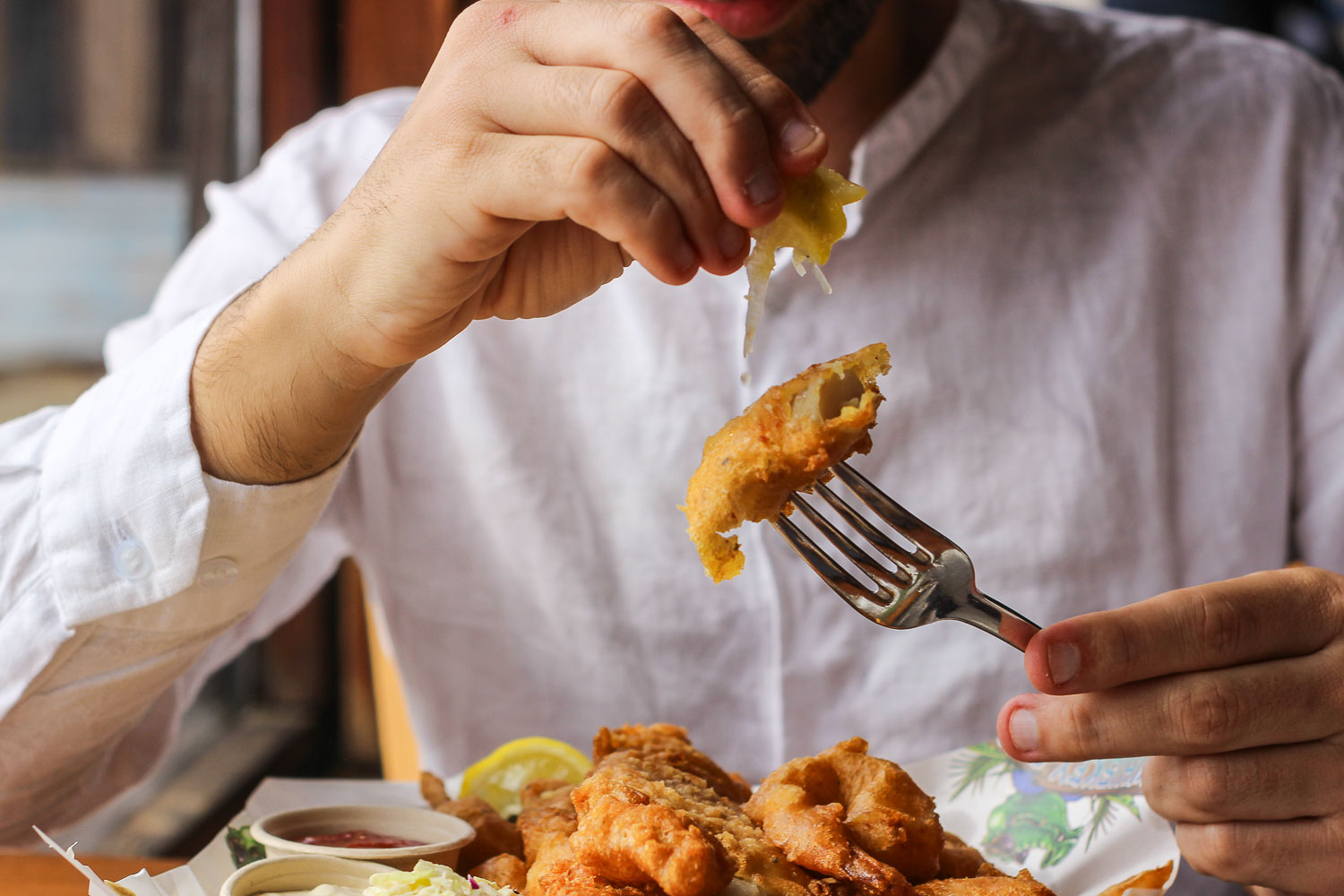 Toti eating fried calamari in Whiskey Joe's