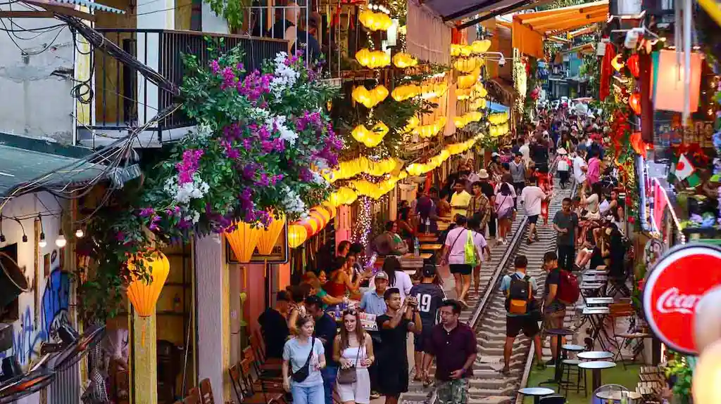 Le Duan Section of Hanoi where it pass the fast train in between coffee shops and bars