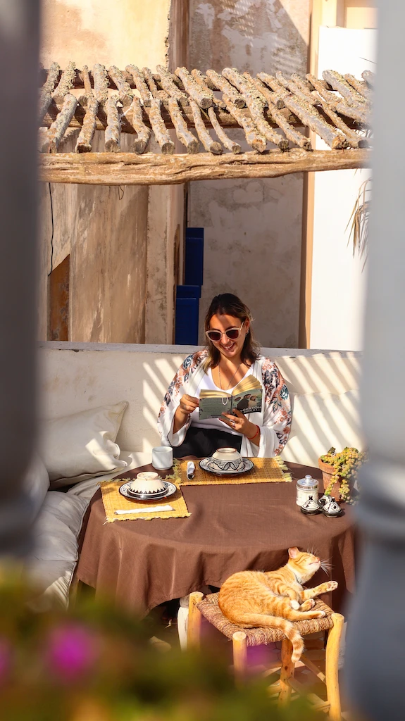 Reading a book on the terrace of Riad Baladin | Where to stay in Essaouira