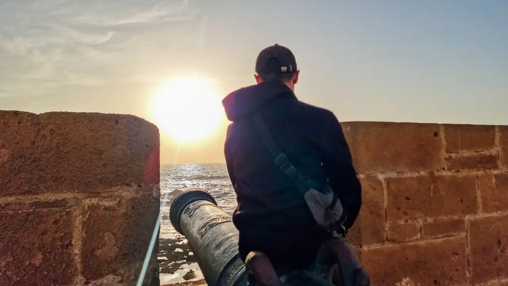 Enjoying a lovely sunset from Essaouira city walls Is Essaouira worth visiting? Toti enjoying a beautiful sunset over the sea