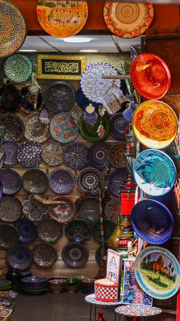 Traditional Majolica and plates in Fes constitute the best gift from morocco and our favourite backdrop for iconic photos from Fes. This shop is beautiful and  around Souk Attarine Fes