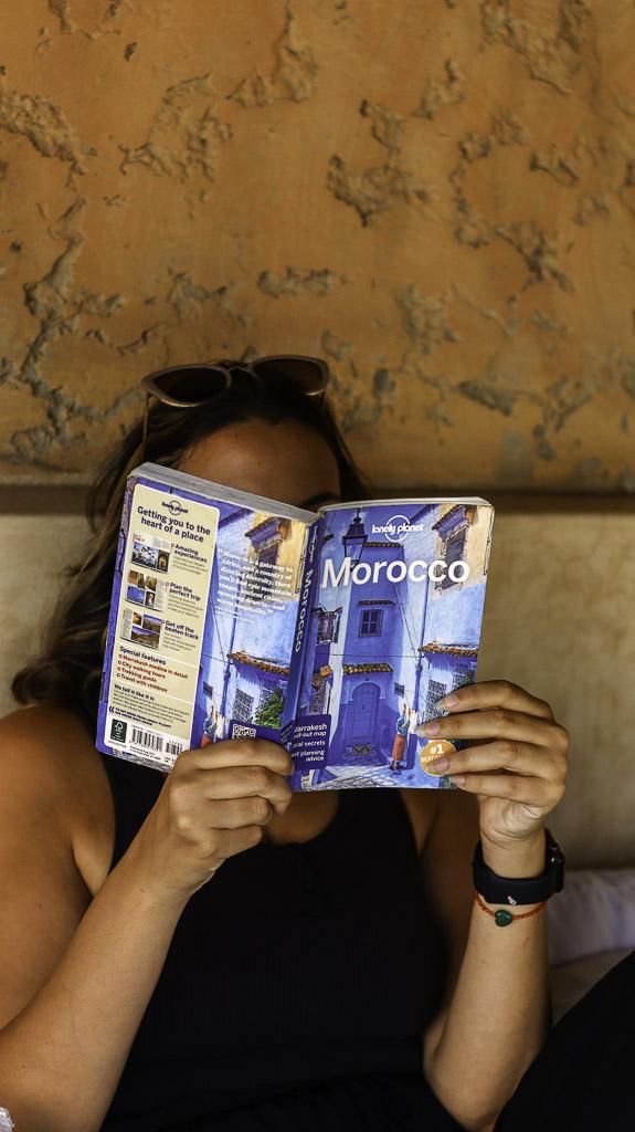 Reading a beautiful book about Morocco in the RIad Tizwa Marrakech