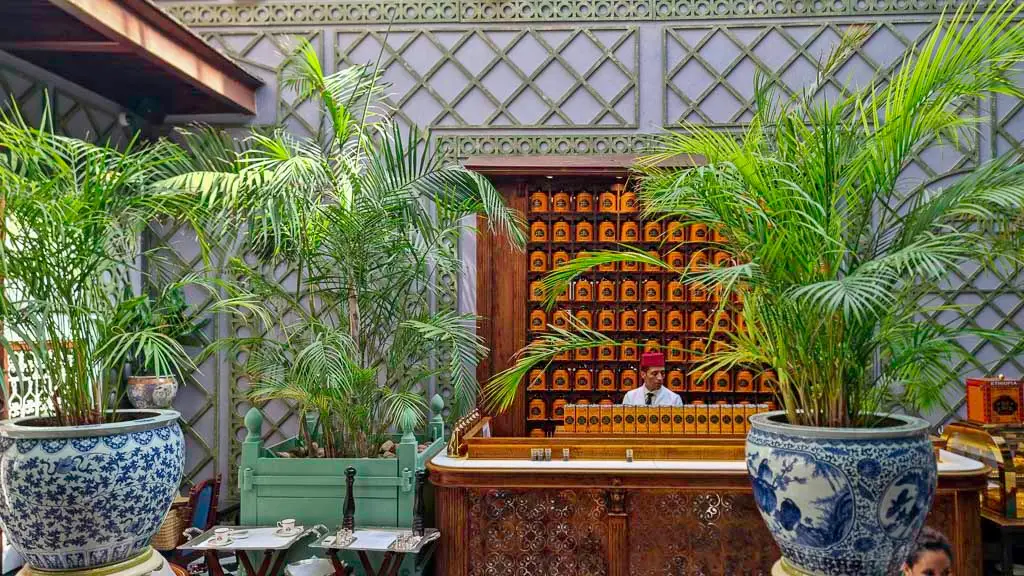 Different types of coffee at Bacha Coffee Marrakech with the Master coffee puring a cup of fresh brewed coffee.