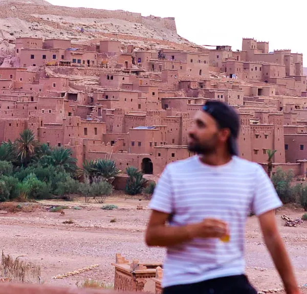 Admiring the view of AIt Benhaddou while backpacking in Morocco