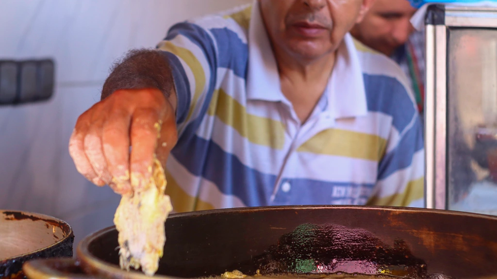 Cooking fried sardines in Marrakech