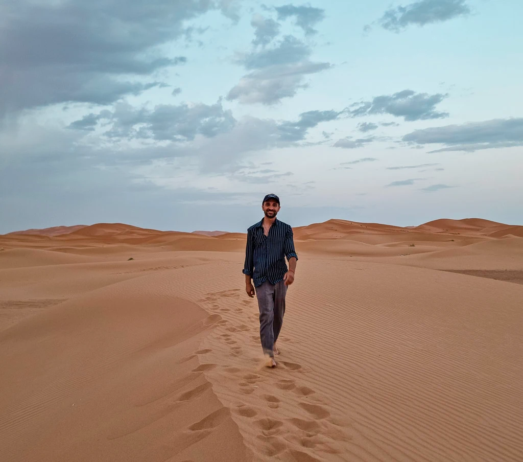 Toti walking around the desert in Morocco - Including Merzouga to our 10 days Morocco itinerary