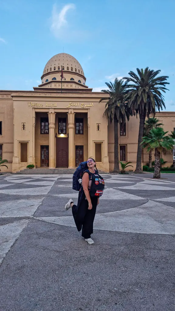 Morocco itinerary for backpackers - Ale standing in front the opera house in Marrakech after arriving by bus from Essaouira