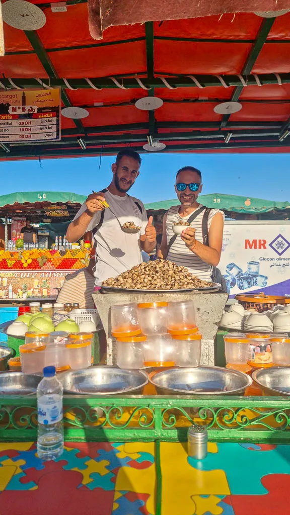 Toti and the local guy selling snails in the main square of Marrakech