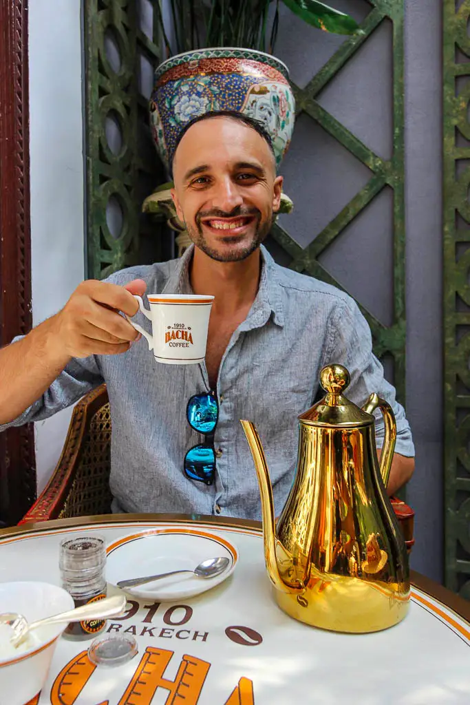 Toti drinking coffee at Bacha cafe Marrakech Toti Maisto Content creator, blogger, traveller, Digital nomad and speaker drinking a coffee at Bacha coffee in Marrakech Morocco
