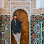 Toti laying on the door of Ben Youssef Madrasa | Passport and Stamps