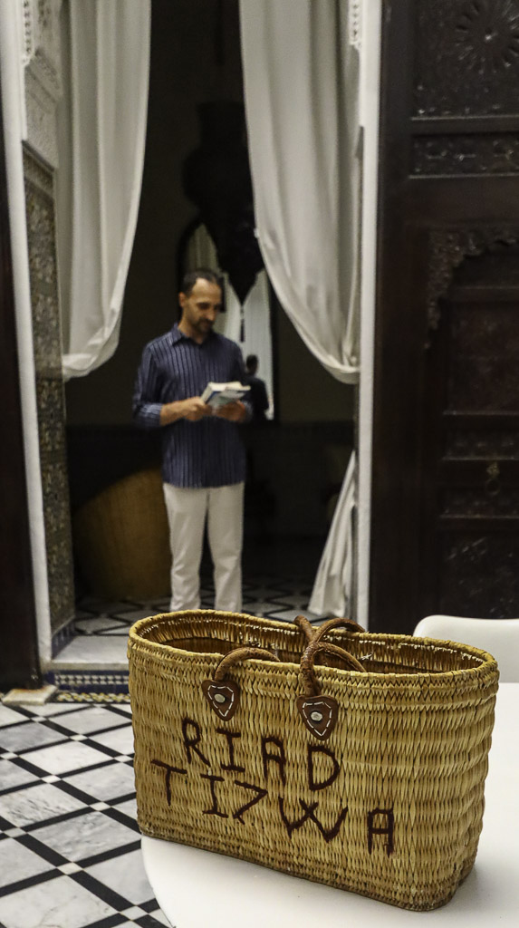 Incredible spot of Riad Tizwa in Fes - Toti reading a book