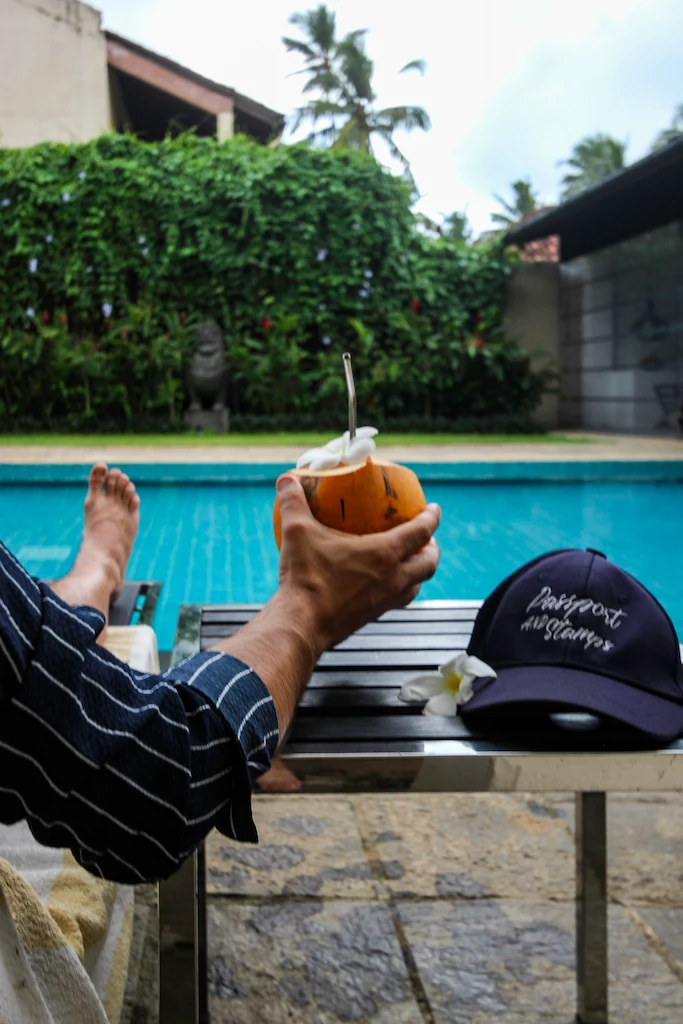 lounges in Bentota private villa Toti drinking coconut at The muse hotel pool by Nyne Hotels