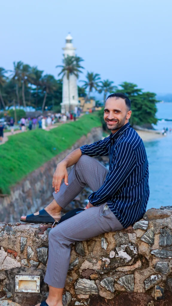 Toti sitting and enjoying the lighthouse view in Galle Sunset from the lighthouse and the rampart in Galle