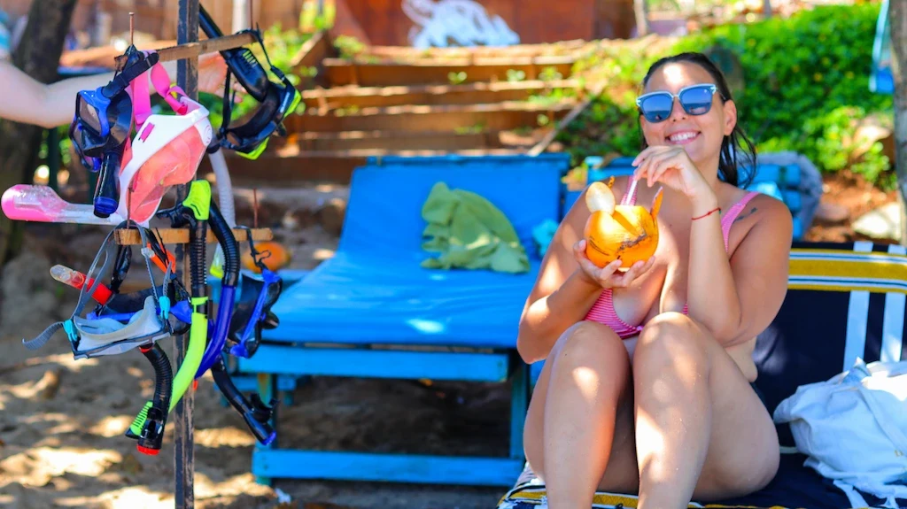 Enjoying a coconut on the beach of Dickwella