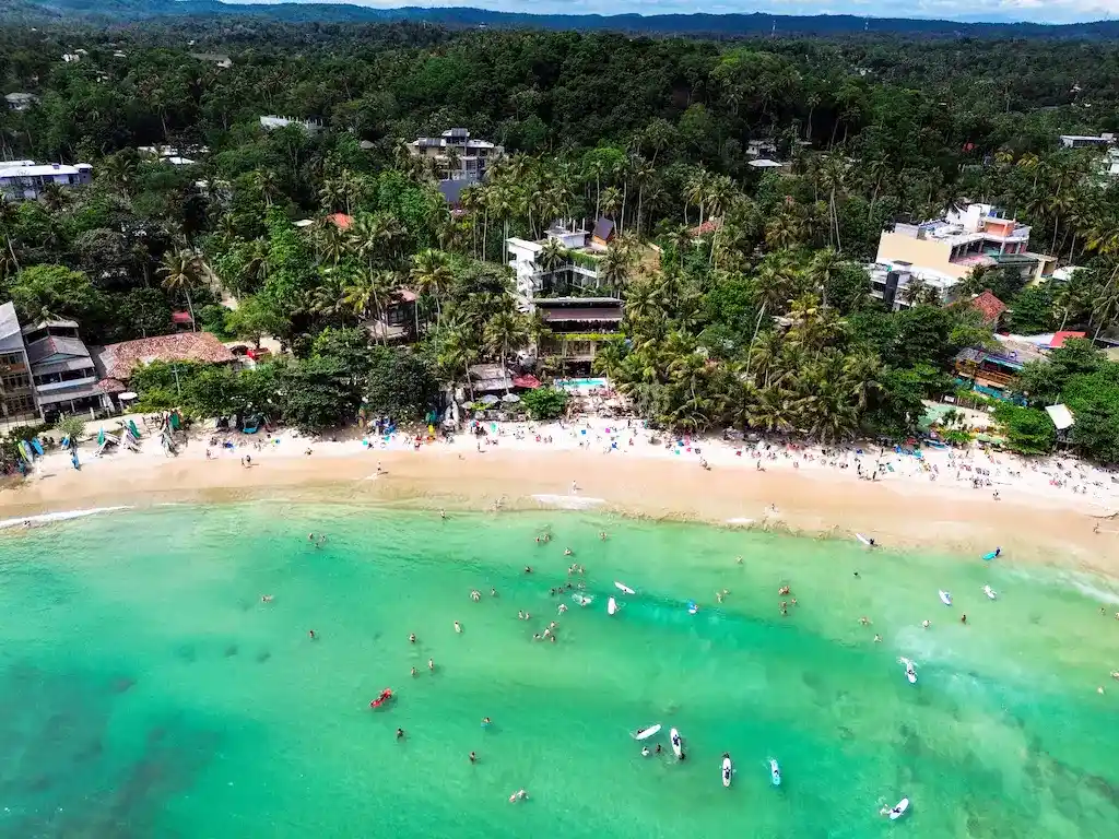 Hiriketiya bay beach The Bay of Hiriketiya from above - Drone shot by Passport and Stamps