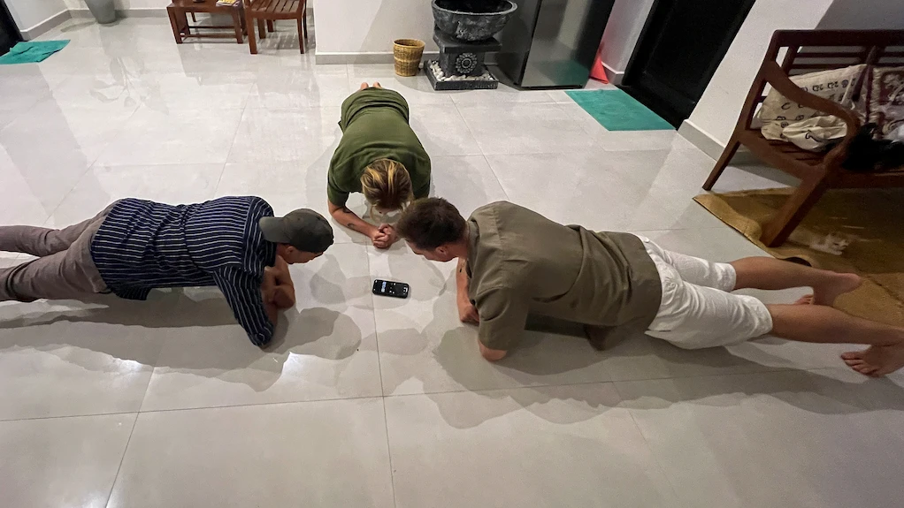 Doing fun games at Slow Life Nomadico in Hiriketiya - Toti and friends doing planks