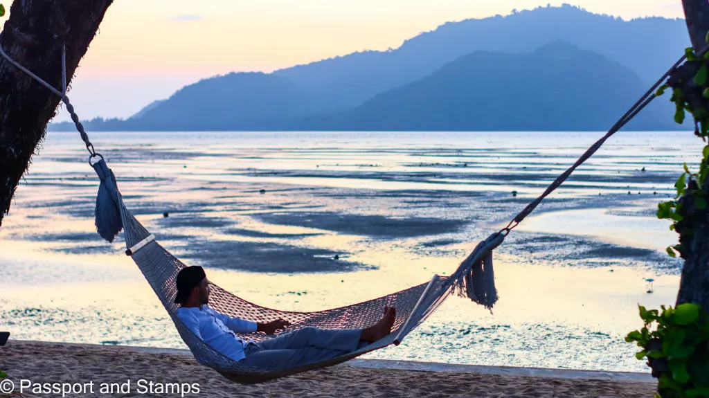 Toti enjoying the quiet afternoon in the hammok by the shore at Vijitt Resort